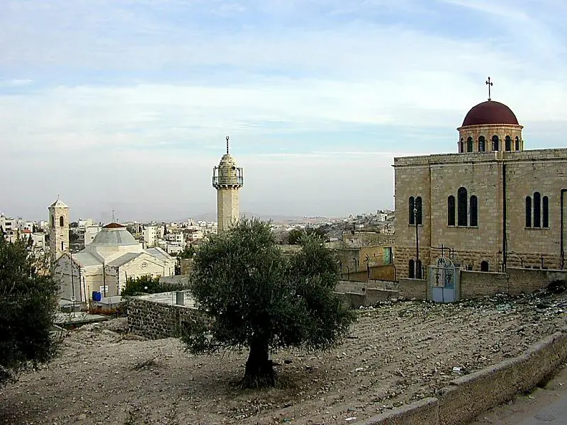 Location of Bethany. The ancient village of Bethany is today known as el-Azarieh, preserving the name of Lazarus, brother of Mary and Martha. Jesus stopped short of Jerusalem to spend the night and enjoy a feast with his friends (Jn. 12; Mk. 14). The site is today commemorated by two churches (Roman Catholic - left; Greek Orthodox - right) with the traditional tomb of Lazarus in between (cf. Jn. 11). On the following day when Jesus headed into Jerusalem, he stopped at Bethphage to mount a colt before riding in to the acclamations of the crowd.
