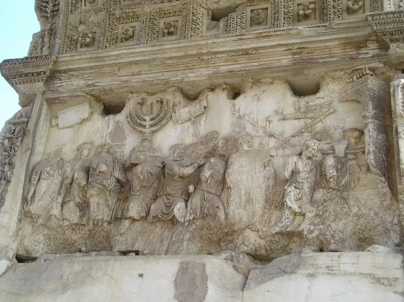 The Arch of Titus depicting the consequences of an ill-advised war. The spoils of Jerusalem’s Temple are carried off by Roman soldiers. (Photo courtesy of Douglas Priore.)