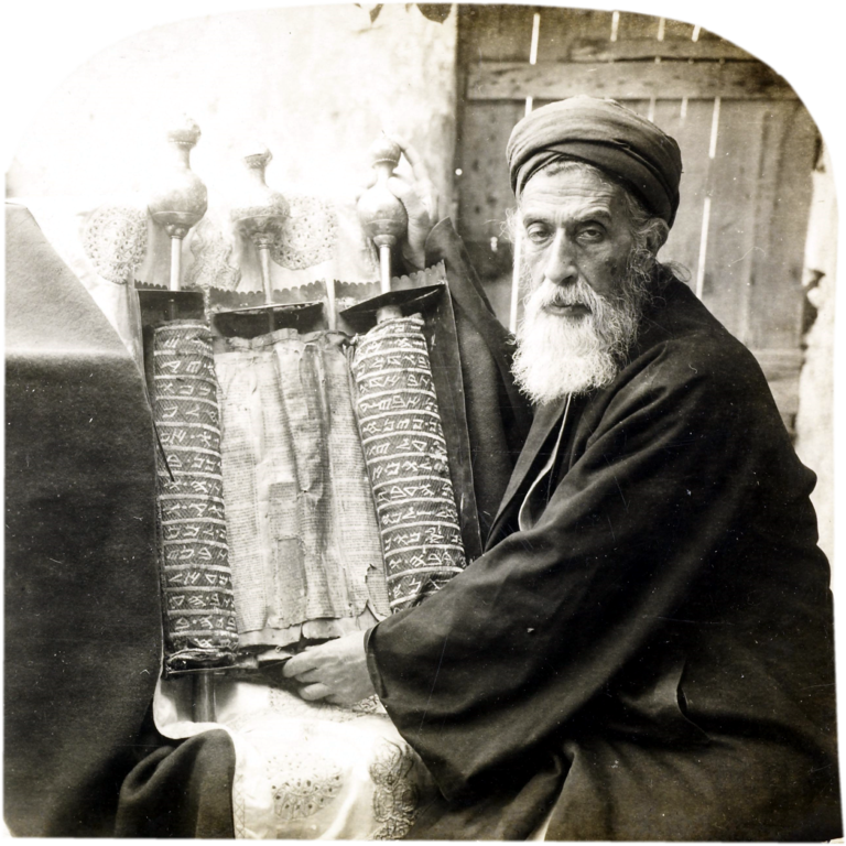 Jacob ben Aaron, Samaritan high priest, holding an ancient Samaritan Torah Scroll. Photographed in the late 1800s. A description of this image is found in Jesse Lyman Hurlbut, Traveling in the Holy Land Through the Stereoscope (New York: Underwood & Underwood, 1900), 137-139. Image courtesy of Wikimedia Commons.