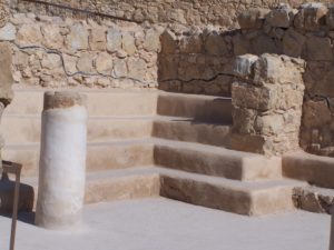 Benches lining the interior of the synagogue on Masada. Photographed by Joshua N. Tilton.