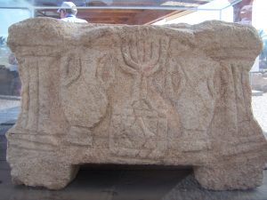 A limestone table from Magdala. It bears the earliest known depiction of the Temple's menorah. Photo courtesy of Joshua N. Tilton.