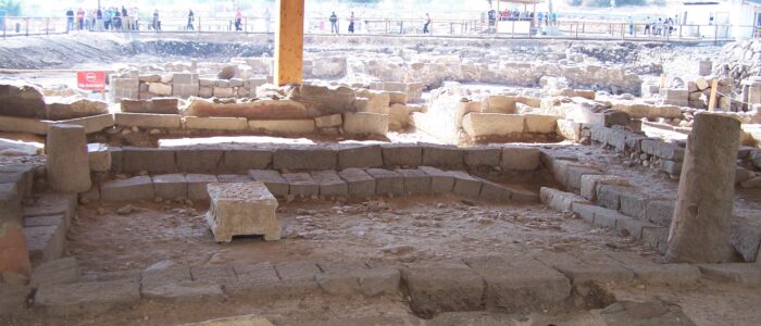 Interior of the synagogue at Magdala with the limestone table in the center surrounded by stone benches. Photographed by Joshua N. Tilton.