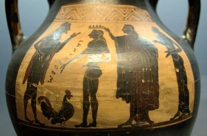 Greek amphora (ca. 510 B.C.E.) depicting the presentation of Ganymede with a rooster by the god Zeus. Image courtesy of <a href="https://commons.wikimedia.org/wiki/File:Zeus_Ganymedes_Staatliche_Antikensammlungen_6009.jpg" target="_blank" rel="noopener noreferrer" class="nolightbox">Wikimedia Commons</a>.