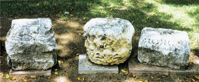 Three ornamented architectural elements found on el-Araj's surface: (from left to right) a limestone pillar base, a limestone Corinthian capital, a basalt frieze decorated with "eggs and darts" design. These objects are now displayed on the grounds of Kibbutz Ein Gev. Perhaps they once were part of the ancient synagogue of Bethsaida.