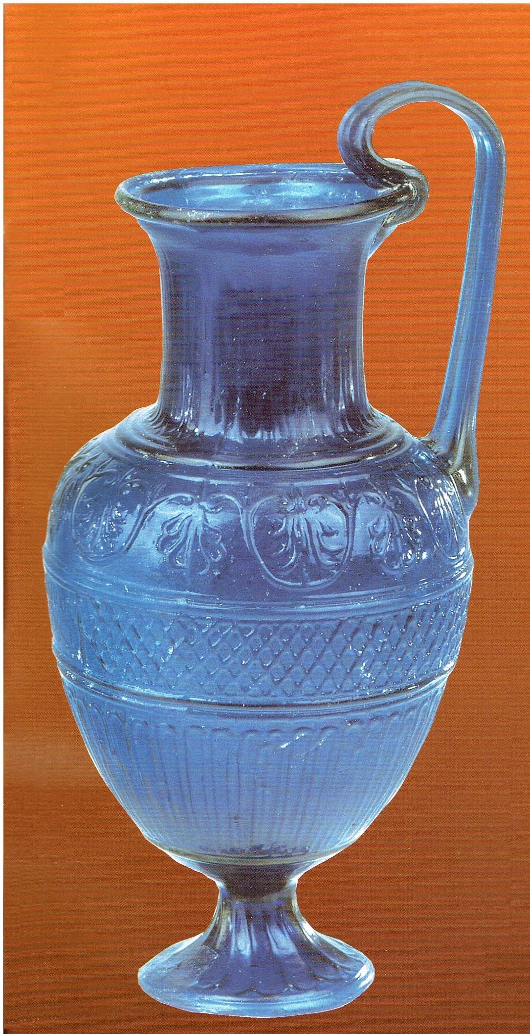 This perfectly preserved copy of the pitcher in the previous photo, thought to have been found in Jerusalem and smuggled out of Israel, turned up on the antiquities market in New York and was purchased by a private collector. The height of the pitcher, including its handle, is 22 cm. (Glass Pavilion, Eretz Israel Museum, Tel-Aviv)