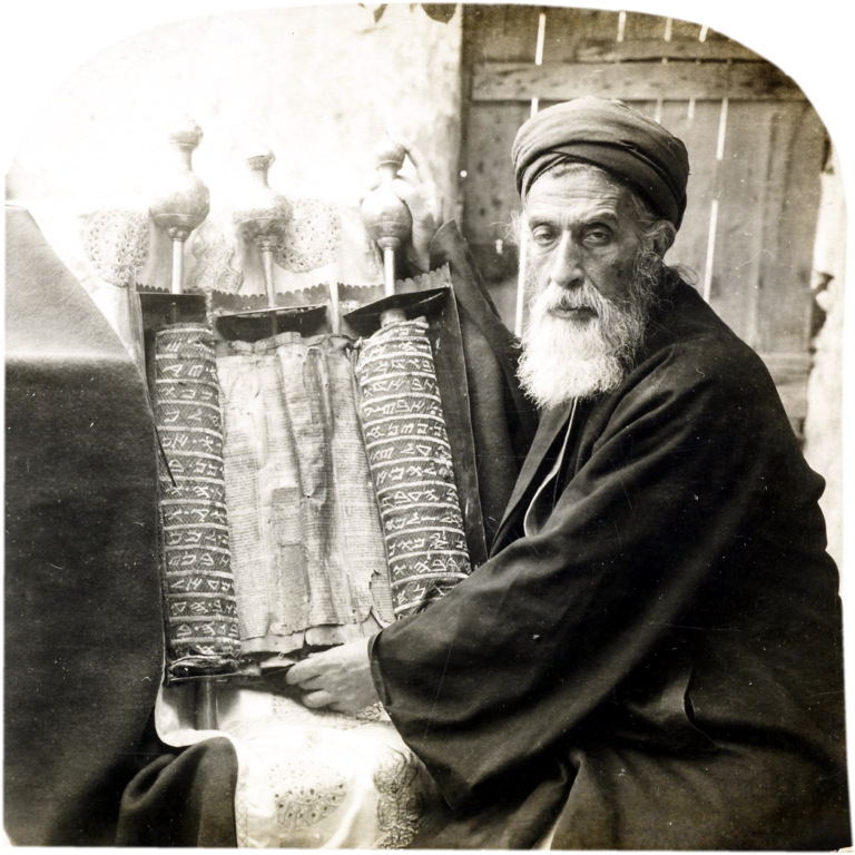 Jacob ben Aaron, Samaritan high priest, holding an ancient Samaritan Torah Scroll. Photographed in the late 1800s. A description of this image is found in Jesse Lyman Hurlbut, Traveling in the Holy Land Through the Stereoscope (New York: Underwood & Underwood, 1900), 137-139. Image courtesy of Wikimedia Commons.
