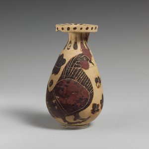 A Greek (Corinthian) perfume vase ornamented with a rooster (ca. 620–590 B.C.E.). Image courtesy of <a href="https://commons.wikimedia.org/wiki/File:Terracotta_alabastron_(perfume_vase)_MET_DP119902.jpg" target="_blank" rel="noopener noreferrer" class="nolightbox">Wikimedia Commons</a>.