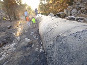 The huge water main that now runs beside the remains of the Roman road that led from Jerusalem to Emmaus. Photographed by Gary Alley, October 17, 2016.