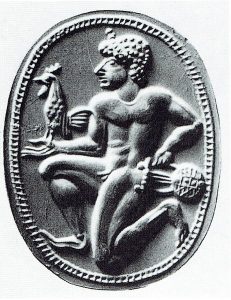 6th century B.C.E. Greco-Phoenician gemstone seal depicting a youth holding a rooster. Image courtesy of <a href="https://commons.wikimedia.org/wiki/File:Greek_Seals_4.jpg" target="_blank" rel="noopener noreferrer" class="nolightbox">Wikimedia Commons</a>.