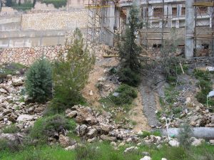 Expansion of the Har Hamenuhot cemetery encroaches onto the path of the Roman road to Emmaus. Photographed by Chris deVries, March 16, 2007.