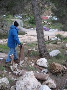 David Bivin surveys the smashed picnic tables destroyed by falling rocks during the careless expansion of the Har Hamenuhot cemetery. Photographed by Chris deVries, March 16, 2007.