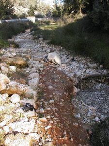 A bit of the road’s curbing in still visible, but most of the road has washed away. Photographed by David Bivin.